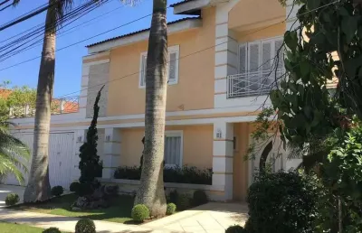Alphaville 09 - casa com 600m², 4 suítes, 4 vagas, piscina, hidromassagem, adega