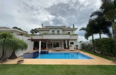 Sobrado de alto padrão à venda no condomínio residencial jatobás com 693 m² | 5 suítes, sendo 3 suítes com closet, amplo quintal e 6 vagas de garagem.