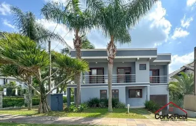 Casa com 4 quartos à venda na rua tocantins, 937, lomba do pinheiro, porto alegre por r$ 1.389.000