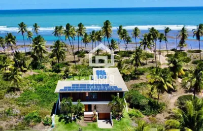 Casa 4 suítes á venda frente mar no condomínio piscinas naturais em praia do forte