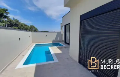 Casa térrea com 3 suítes e piscina no condomínio terras do vale