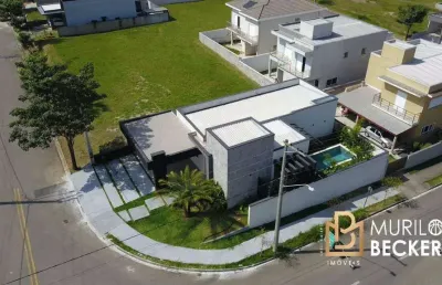 Casa com 3 suítes e piscina no condomínio terras do vale