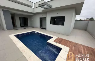 Casa térrea com 3 quartos, 2 suítes e piscina no condomínio terras do vale