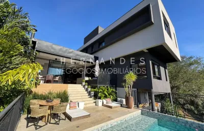Casa de alto padrão em condomínio no tamboré com vista permanente para mata