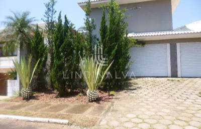 Sobrado mobiliado no condomínio crisálidas com 5 dormitórios, área gourmet e jardim.