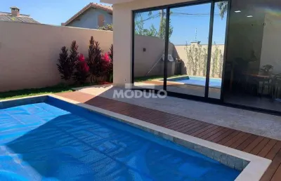 Casa residencial em condomínio para locação, bairro shopping park com 3 suítes