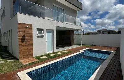 Casa em alphaville litoral norte 2 com 4 suítes piscina e espaço gourmet