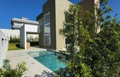 Casa a venda em alphaville litoral norte 3 com 4 suites piscina e área gourmet