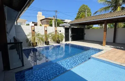 Casa a venda em condomínio fechado vila de joanes com 4 suites