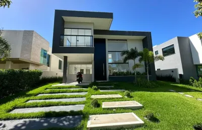 Casa a venda em alphaville litoral norte 1 com 4 suites piscina e área gourmet