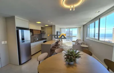 Apartamento 02 dormitórios novo finamente mobiliado a poucos metros do mar em to
