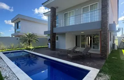 Casa de alto padrão com 4 suítes e piscina voltada para área de preservação – alphaville litoral norte 3