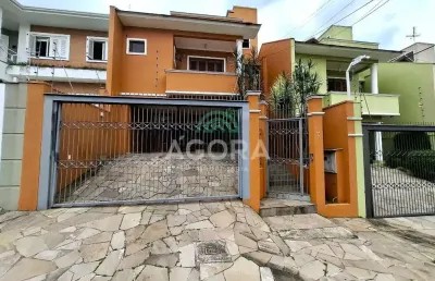 Sobrado com 3 (três) dormitórios,  localizado no bairro moinhos  de vento em canoas .