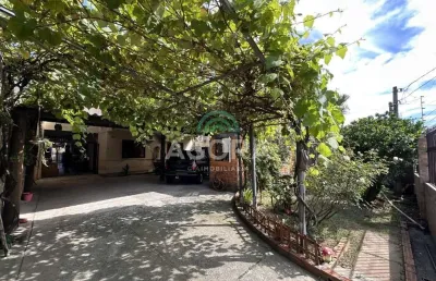Sobrado com 7 (sete) dormitórios, sendo 2 (duas) suítes, localizado no bairro fátima em canoas.