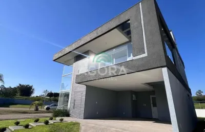 Sobrado condomínio fechado com 4 (quatro) dormitórios, localizado em nova santa rita.