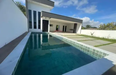 Casa em condomínio três quartos uma suíte e piscina.