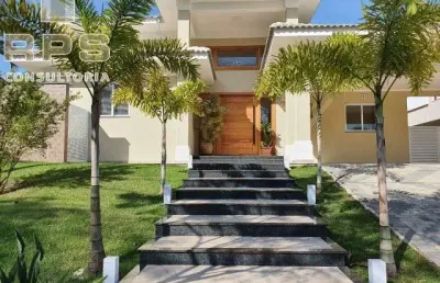 Casa térrea à venda no condomínio porto atibaia, com 3 quartos, escritório, vaga para 8 carros, 5 banheiros, amplo quintal!