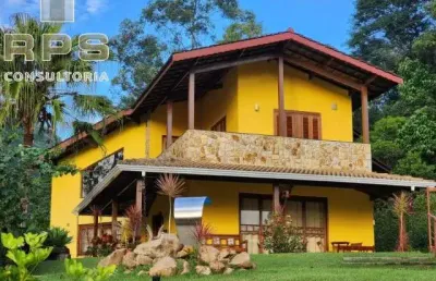 Casa a venda no condomínio palavra da vida com 3 suítes e piscina climatizada, área gourmet com churrasqueira, vaga para 08 carros, portaria 24hrs