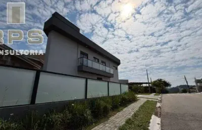 Casa à venda no condomínio terras de atibaia, 3 suítes, conceito aberto, área gourmet integrada, fechadura eletrônica, varanda, aceita financiamento.