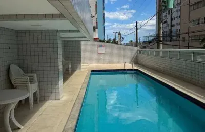 Apartamento 2 dormitórios 1 suíte na guilhermina 100 mts da orla da praia .