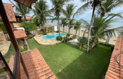 Casa duplex à venda pé na areia, frente mar da praia de santa mônica, guarapari es.