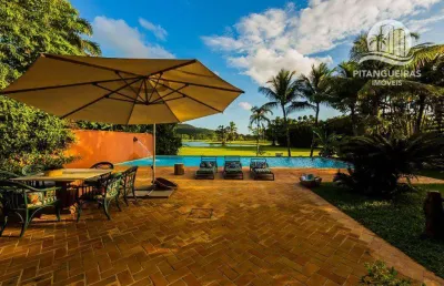 Pernambuco - sala de estar com duplo ambiente, ampla varanda com sofás, 4 suítes e 8 vagas.