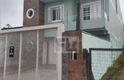 Ótimo sobrado com 3 dormitórios sendo 2 suítes á venda no bairro moradas do bosque em cachoeirinha rs.
