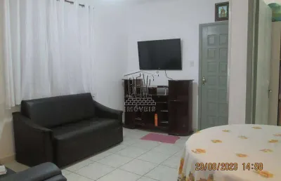 Apartamento com 1 dormitório, sala, cozinha e área de serviço.