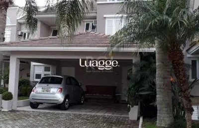 Casa em condomínio fechado, às margens do rio guaíba,