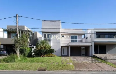 Casa em condomínio fechado com 4 quartos à venda na Avenida Juca Batista, 9087, Belém Novo, Porto Alegre