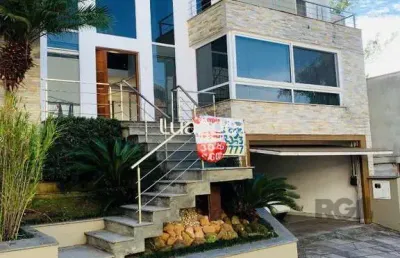 Casa em condomínio fechado com 3 quartos à venda na Rua Tocantins, 596, Lomba do Pinheiro, Porto Alegre