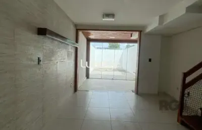 Casa com 3 quartos à venda na Rua Heitor Kramer, 161, Guarujá, Porto Alegre