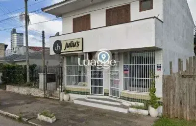 Apartamento de frente com 1 dormitório, sala, cozinha e sacada.