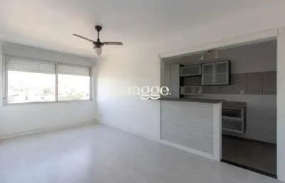 Apartamento semimobiliado à venda no bairro cristal, 2 dormitórios, 2 banheiros, 1 vaga coberta e vista livre para o guaíba