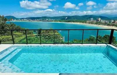 Casa nova com vista total para o mar no condomínio península na praia da enseada.