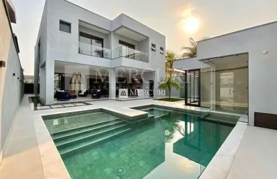 Casa no guarujá, condomínio fechado, jardim acapulco e 5 suítes - mercuri imóveis - imobiliária