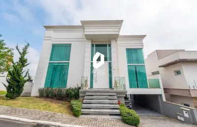 Casa mobiliada com 04 suítes, espaço gourmet e 04 vagas!