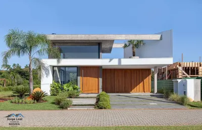 Casa em condomínio 3 dormitórios à venda condomínio reserva das águas torres/rs