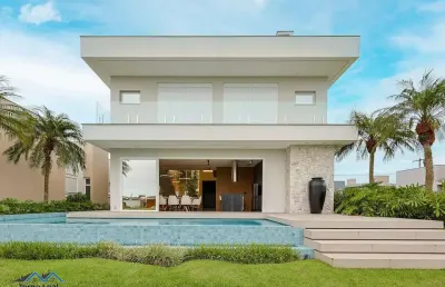 Casa em condomínio 4 dormitórios à venda condomínio reserva das águas torres/rs
