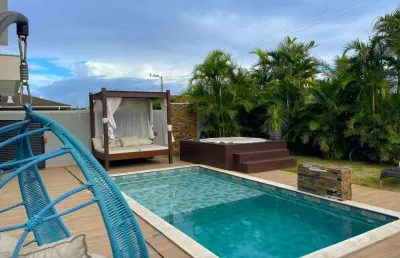 Em condomínio fechado com 3 suítes,  jardim com piscina, jacuzzi e 4 vagas no são joão do rio vermelho - á  venda em florianópolis