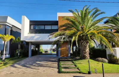Casa mobiliada 4 suítes no reserva das águas torres rs