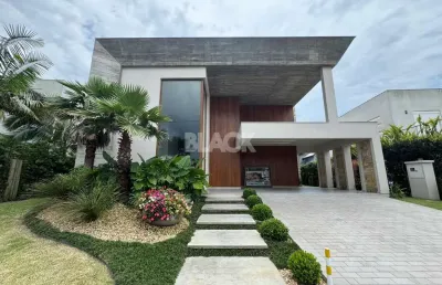 Casa com 4 suítes no condomínio ocean side em torres rs