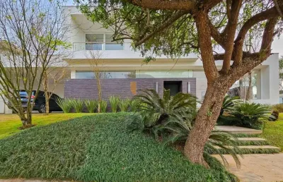 Casa mobiliada com 338m² com 3 suítes em terreno de 806m² - alphaville/gravataí