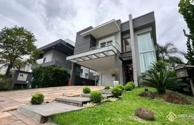 Casa com 4 suítes mobiliada e decorada no condomínio alphaville em gravataí/rs