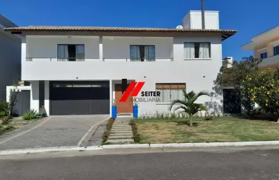 Casa à venda em condomínio fechado na cachoeira do bom jesus em canasvieiras