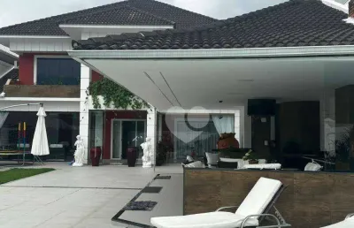 Casa com 4 suítes e lazer privativo em condomínio na barra da tijuca - porteira fechada