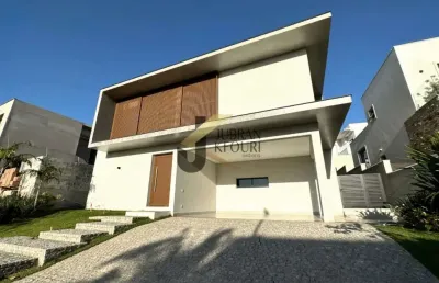 Casa à venda  no  alphaville dom pedro, com 5 suítes (1 térrea), piscina e garagem para vários carros