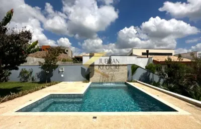 Casa em condomínio à venda em sousas com 4 suítes, lazer privativo e garagem para vários carros.
