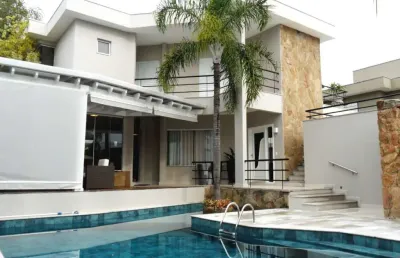 Casa à venda no alphaville campinas, 4 suítes (1 master com varanda), piscina e espaço gourmet