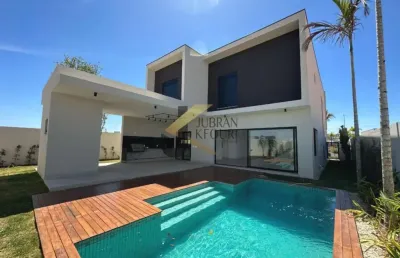 Casa à venda em condomínio - campinas, com 4 suítes (1 máster), lazer comum e garagem para vários carros.